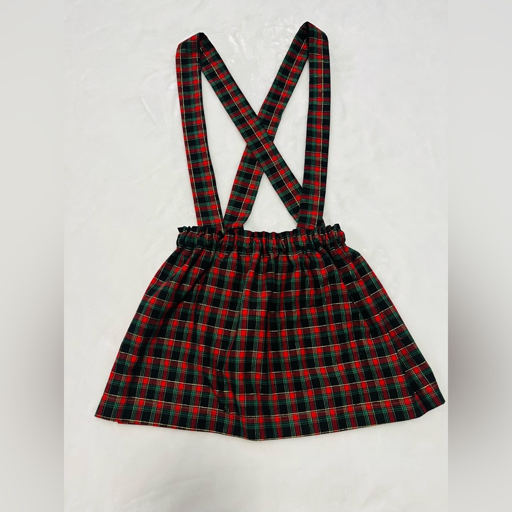 Child skirt with adjustable suspenders and hairbow